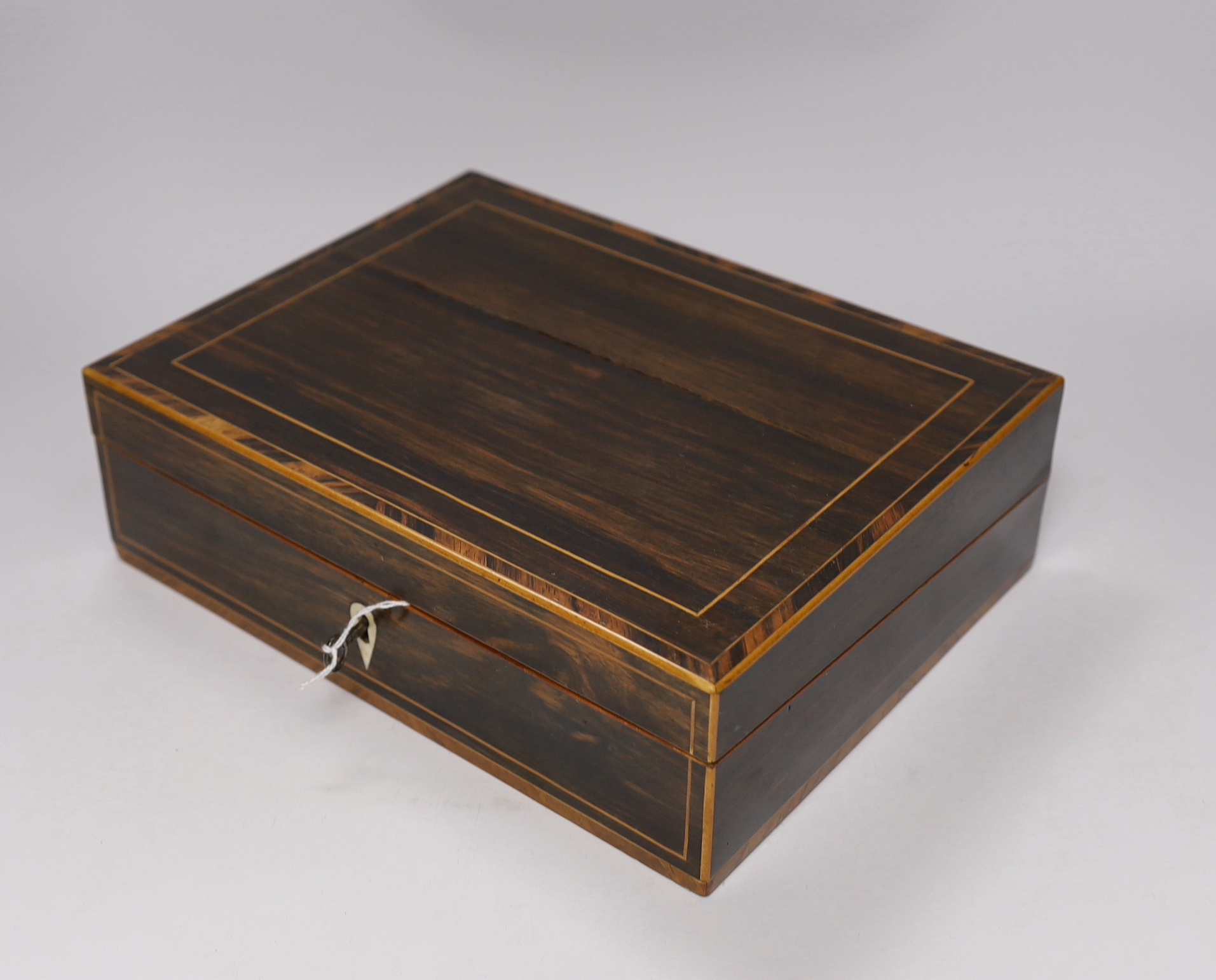 A 19th century coromandel writing slope with bone lock escutcheon and a Victorian silver mounted stationery box, largest 30cm wide